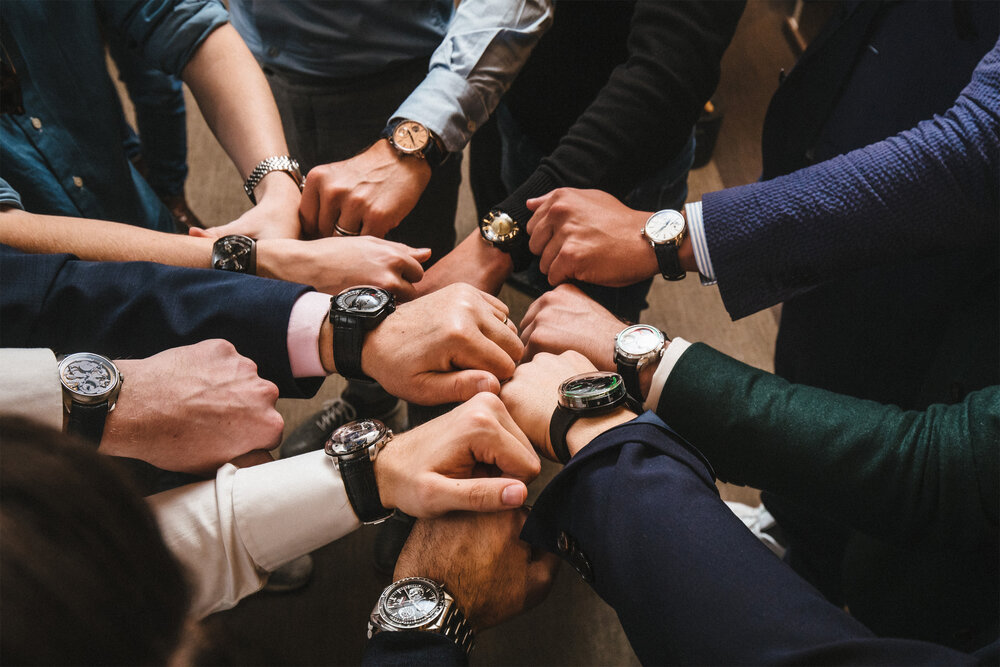 Watch enthusiasts showing their timepieces